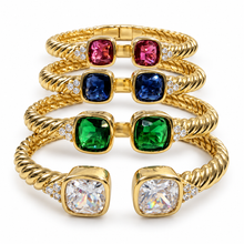Cargar imagen en el visor de la galería, Four 18K gold-plated hinged cuff bracelets in clear, green, blue and raspberry pink on a white background