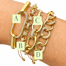 Cargar imagen en el visor de la galería, Glam Knots gold-tone crystal bracelets on the wrist, labeled A, B, C and D, against white