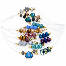 Cargar imagen en el visor de la galería, Illusion clear-cord chokers with assorted faceted crystal accents arranged on a white background