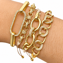 Cargar imagen en el visor de la galería, Four Glam Knots gold-tone adjustable bracelets with crystal details on a wrist against white