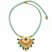 Cargar imagen en el visor de la galería, Celestia by Selig &amp; Co. Aqua and gold cord, green cubic zirconia teardrops, gold thread macrame sliding knot. White background.
