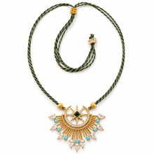 Load image into Gallery viewer, Celestia adjustable moon and star necklace with a green and gold cord, 18K gold-plated pendant and cubic zirconia on a white background.
